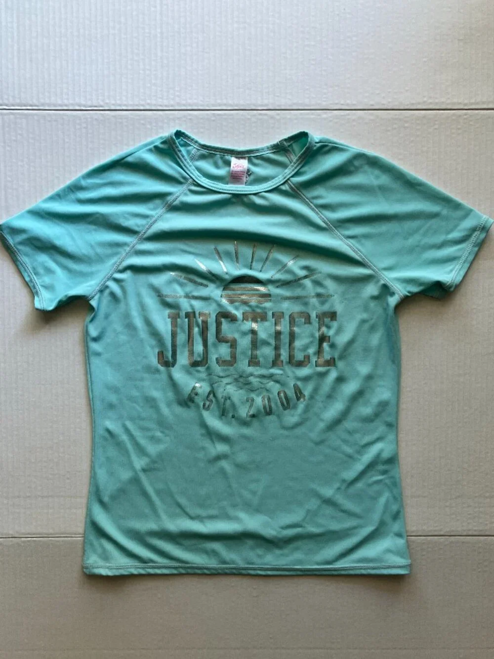 Vintage Justice Light Blue Short-Sleeve Rashguard with Silver Writing